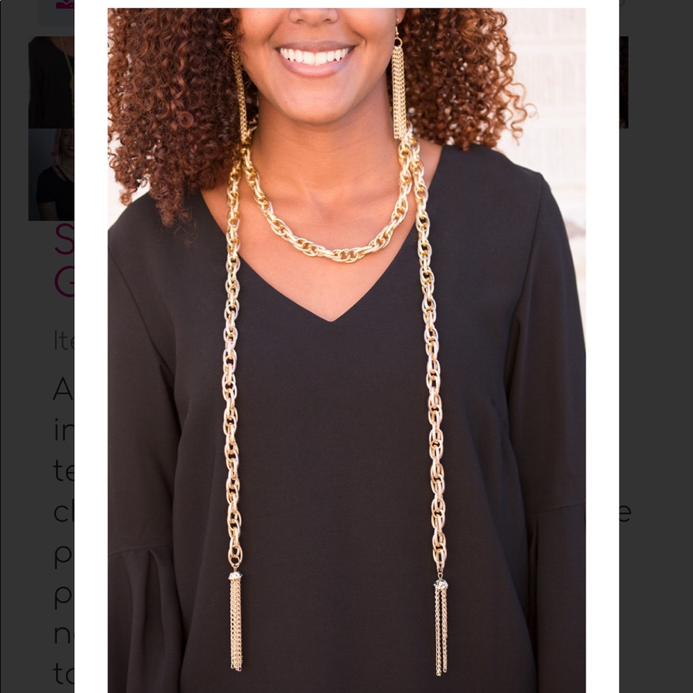 Dramatic length gold chain, along with earrings.